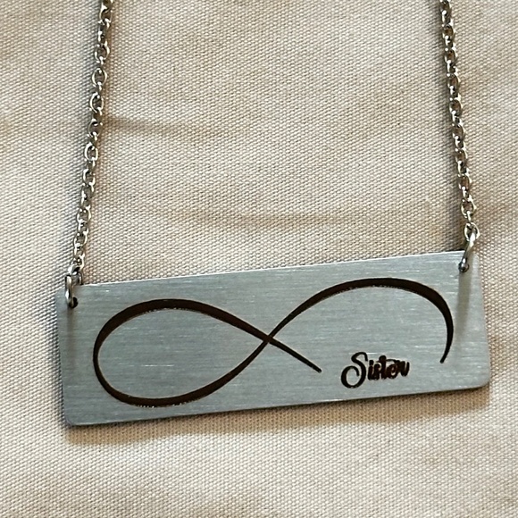 Silver tone rectangular plate on chain w/etched infinity symbol says “Sister” - Picture 2 of 15